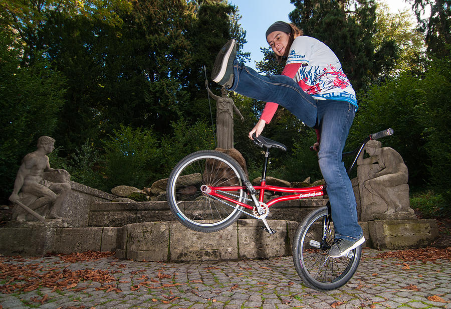 Alive and kicking - BMX Flatland power girl Photograph by Matthias Hauser