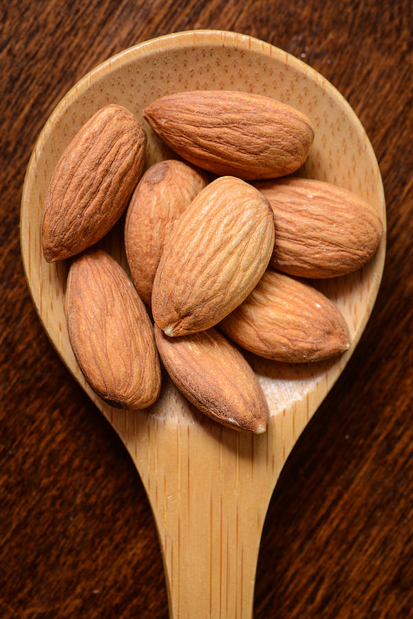 Almonds in a Wooden Spoon Close Up Photograph by Brandon Bourdages