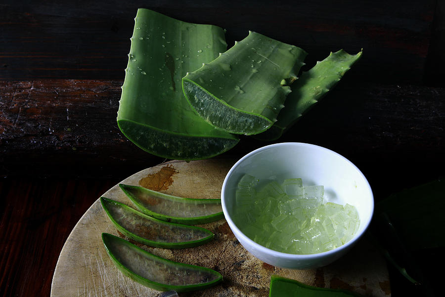 Aloe vera on wooden background Photograph by Thang Tat Nguyen