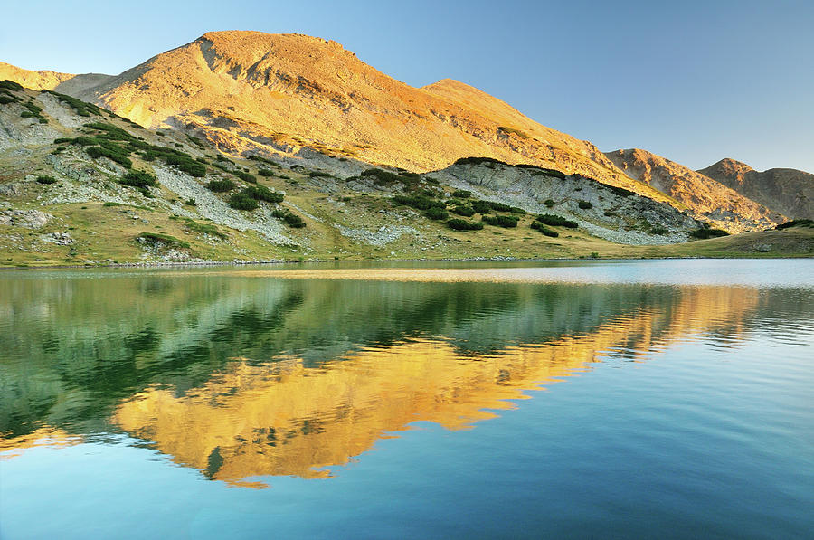 Alpenglow Reflecting On Mountain Lake Photograph by Maya Karkalicheva