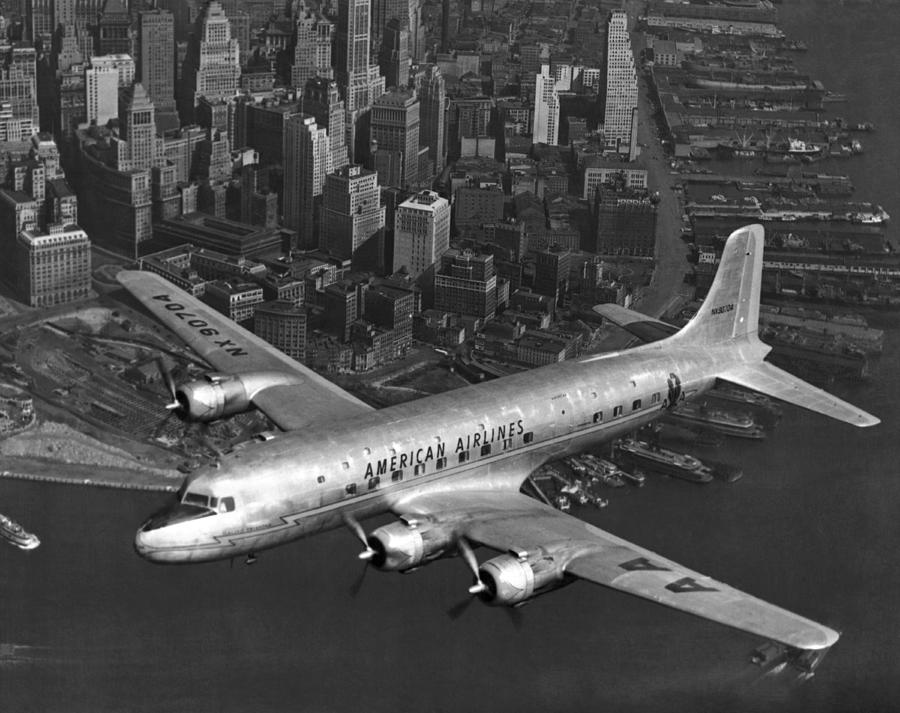 American DC-6 Flying Over NYC Photograph by Underwood Archives