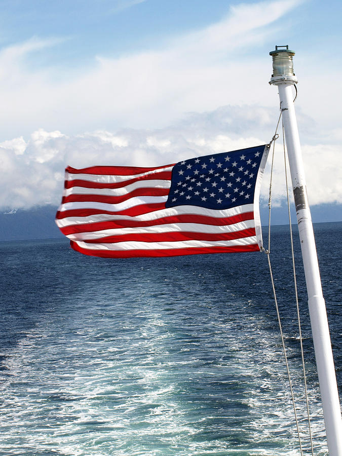 Independence Day Photograph - American Flag Blowing in the Wind at Sea by Jessica Foster