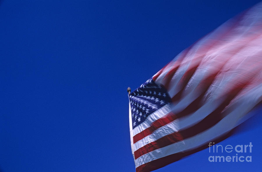 American Flag blurred waving in the wind  Photograph by Jim Corwin