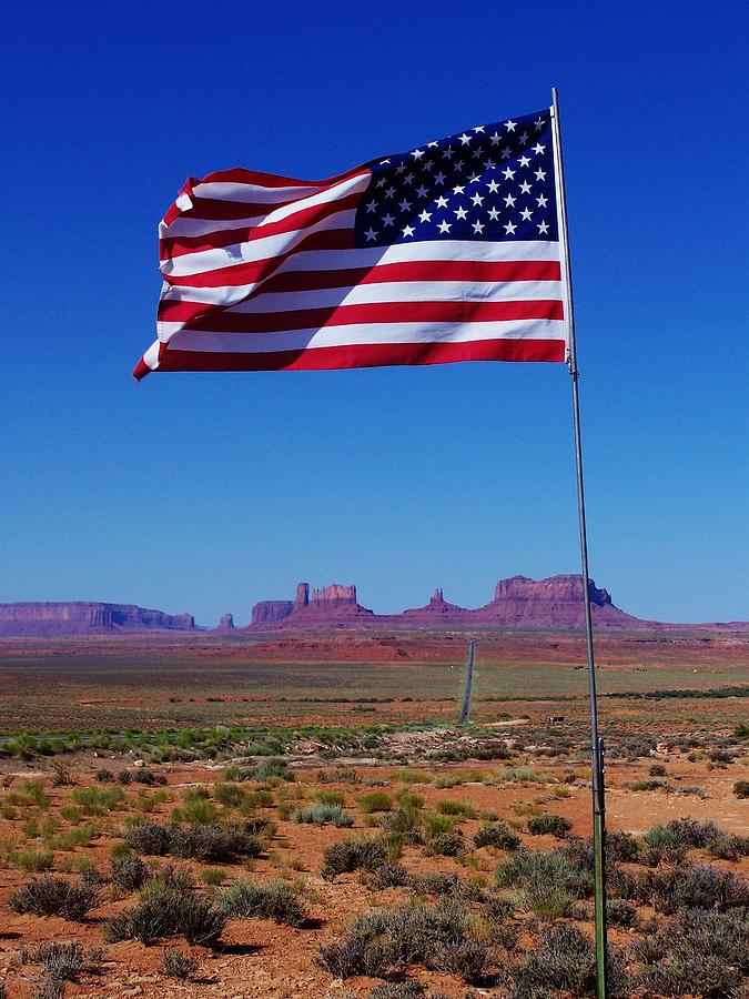 John Wayne Photograph - American Flag in Monument Valley by Dany Lison