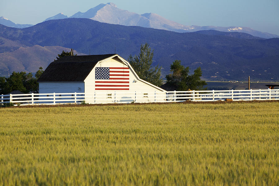 American Flag on Barn in Rocky Mountains Photograph by Beklaus