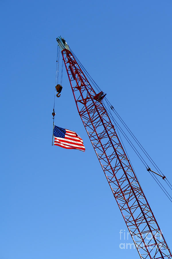 American Flag on Construction Crane Photograph by Olivier Le Queinec