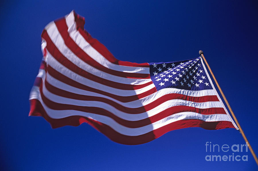 American flag waving in wind Photograph by Jim Corwin