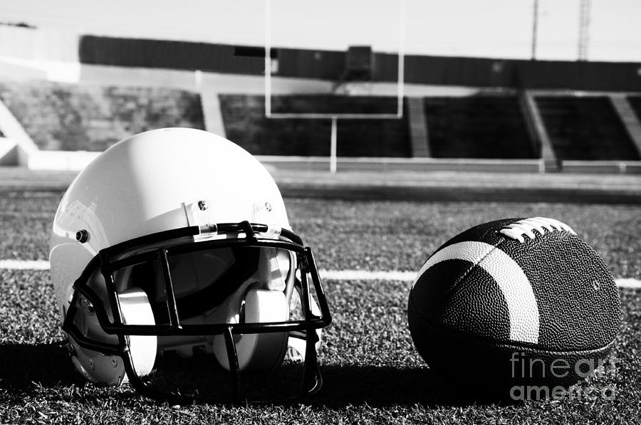 American Football and Helmet on Field Photograph by Danny Hooks
