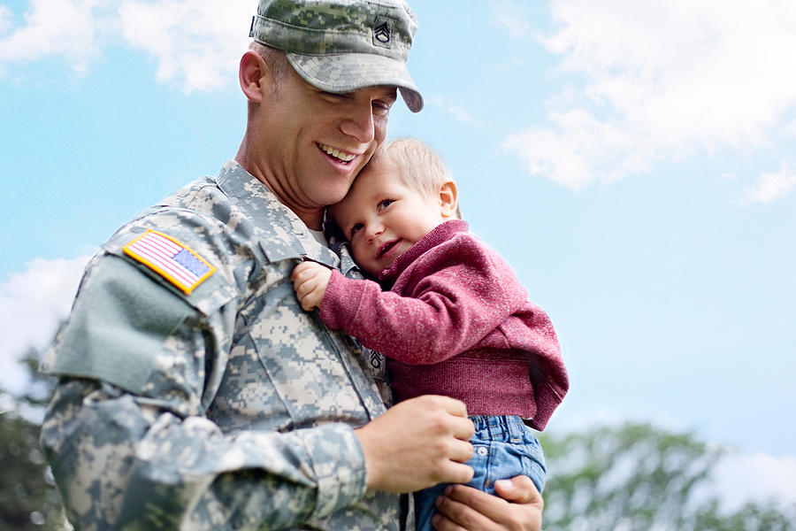 American soldier and son in a park Photograph by DanielBendjy