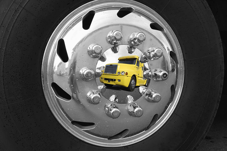 American Super Truck Mirrored In A Shiny Hubcap Photograph by Christian Lagereek