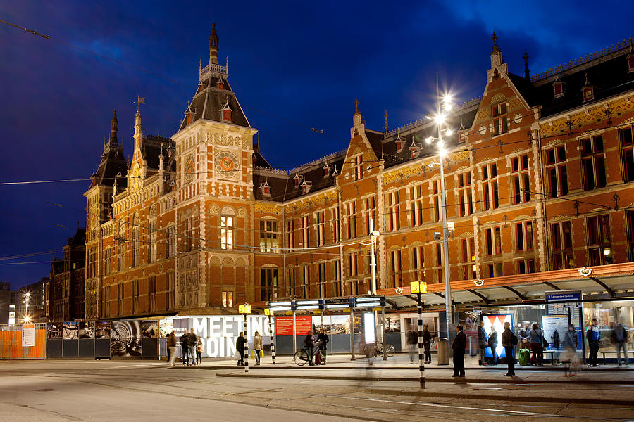 Amsterdam Central Station and Tram Stop at Night Photograph by Artur Bogacki