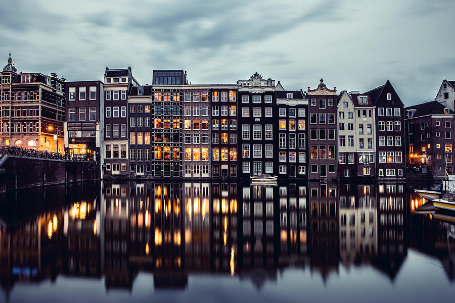 Amsterdam houses reflections at night on the water of the canal Photograph by LeoPatrizi