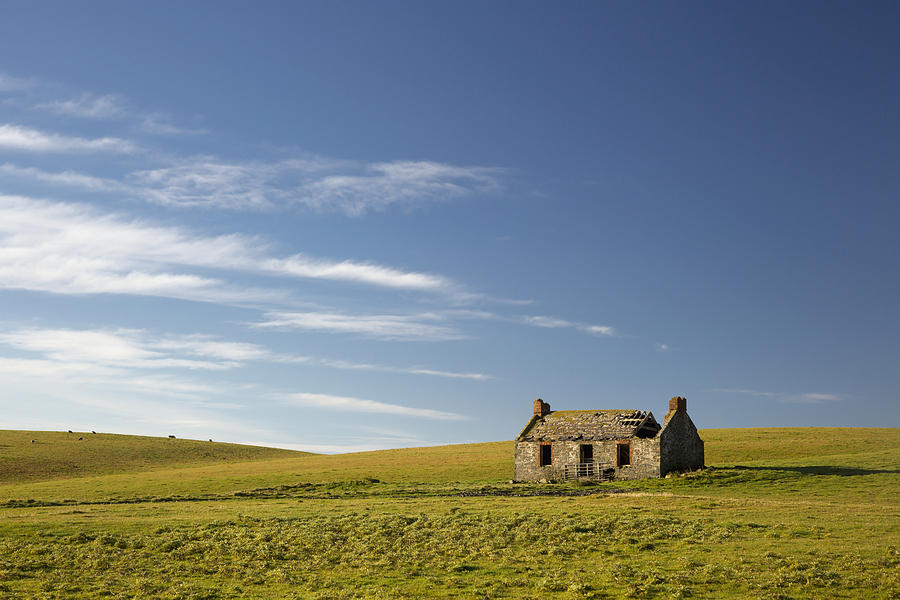 An Abandoned Farm Building Alone In The Photograph by John Short