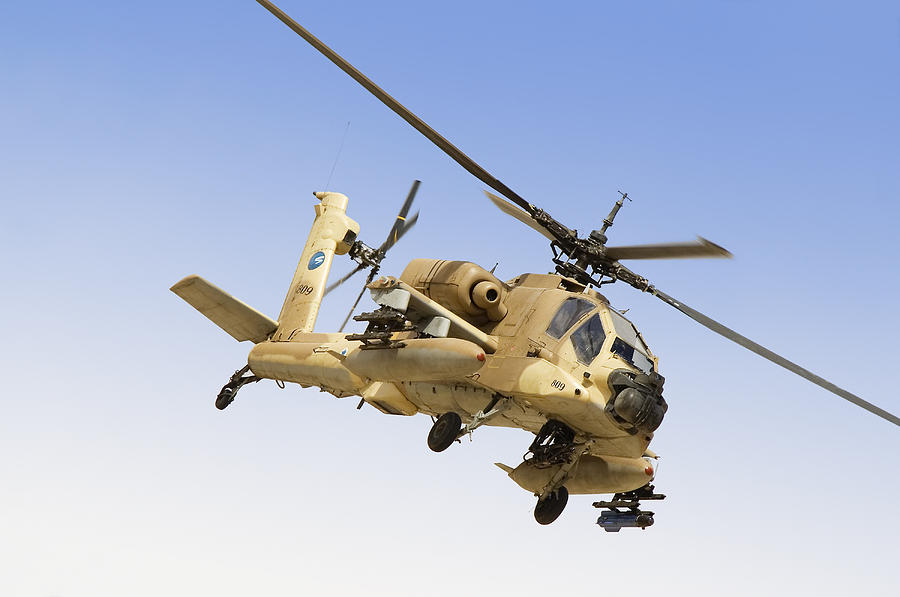 An AH-64A Peten attack helicopter of the Israeli Air Force on its way for a training sortie over Ramon Air Force Base, Israel. Photograph by Ofer Zidon/Stocktrek Images