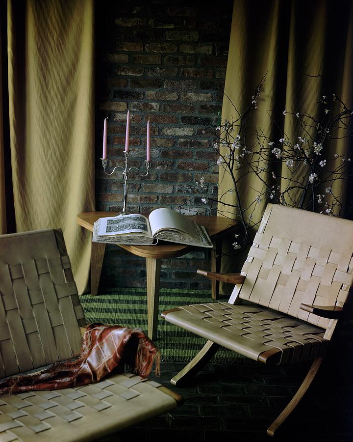 An Armchair Beside A Table And An Old Book Photograph by Horst P. Horst