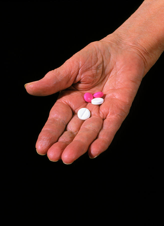 An Assortment Of Pills In Old Persons Palm Photograph by Chris Priest/science Photo Library