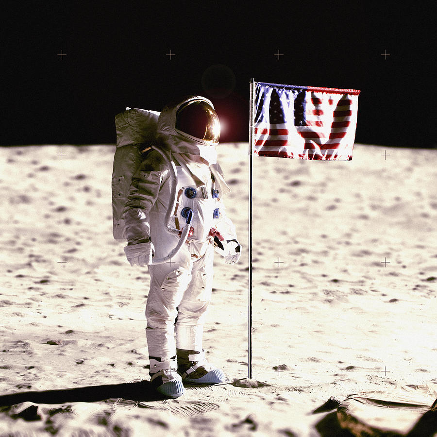 An astronaut next to an American flag on the moon Photograph by Caspar Benson