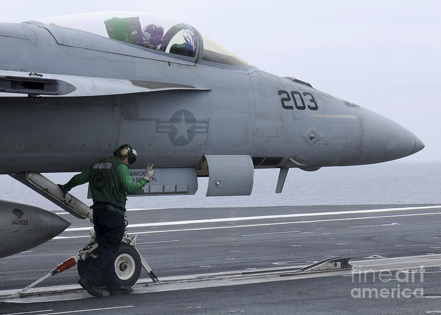 An Aviation Boatswains Mate Prepares An Photograph