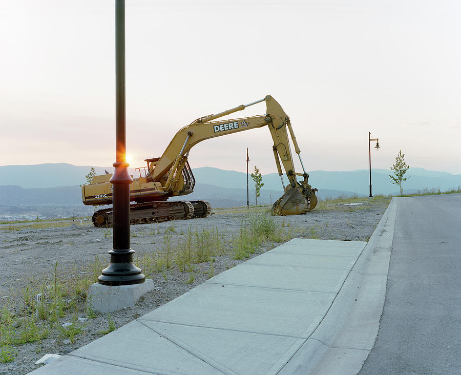 Absence Photograph - An Excavator Sits Idle On An by Andrew Querner