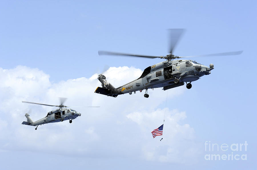 An Mh-60s Sea Hawk Helicopter Follows Photograph by Stocktrek Images