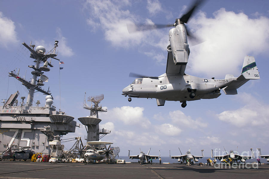 An Mv-22 Osprey Lands Aboard Uss Harry Photograph