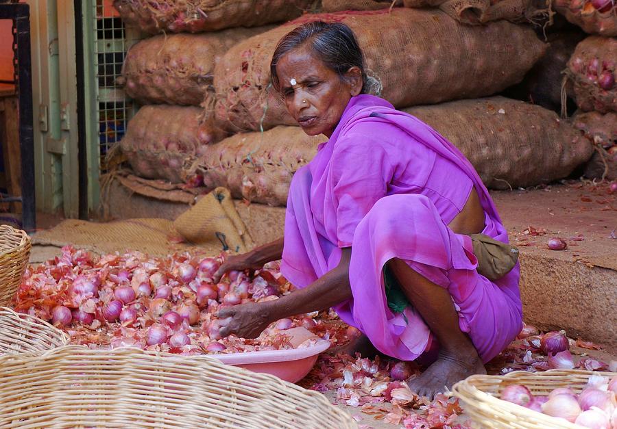 an-old-lady-in-a-purple-sari-is-selling-onions-at-the-market-photograph