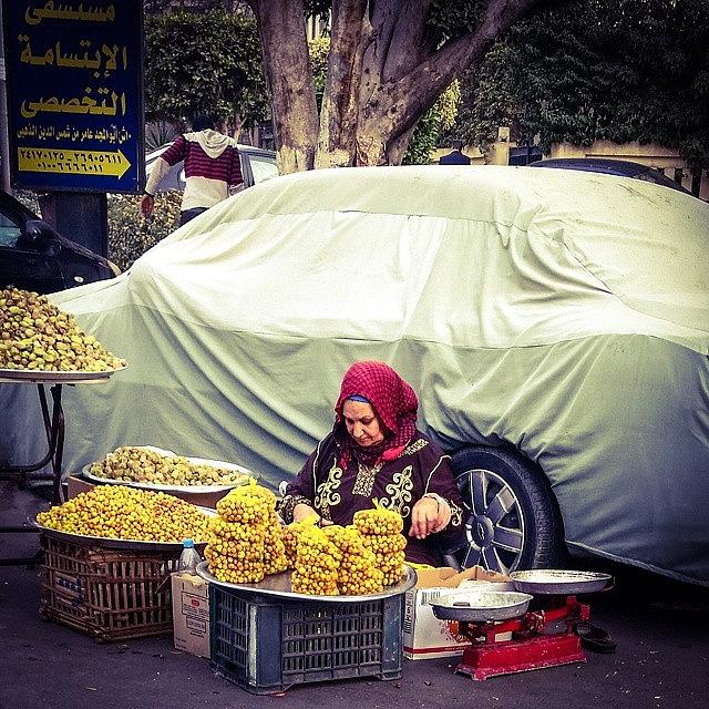 Egypt Photograph - An Old Lady Sells Different Types Of by Mattias Pruym