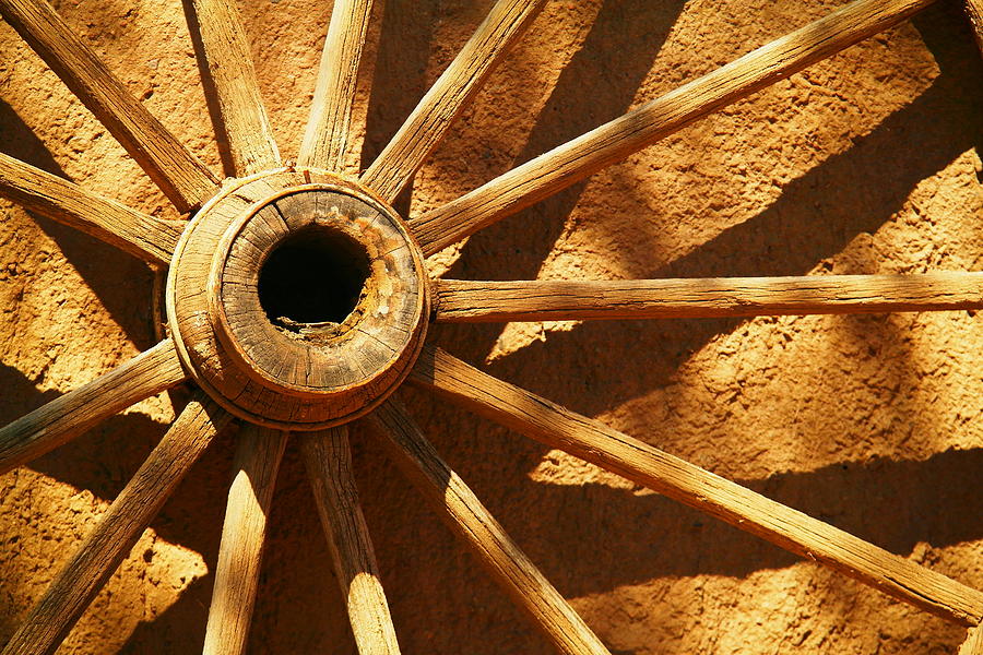 An Old Wagon Wheel In Carillos New Mexico Photograph by Jeff Swan