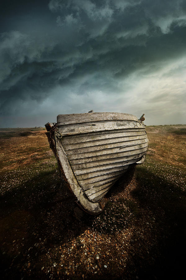 An old wreck on the field. Dramatic sky in the background Photograph by Jaroslaw Blaminsky