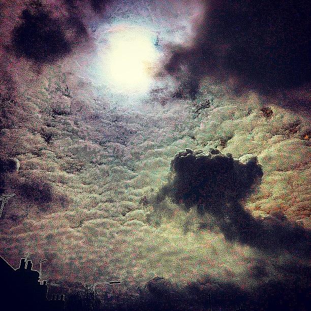 An Uneasy Moon Photograph by Urbane Alien