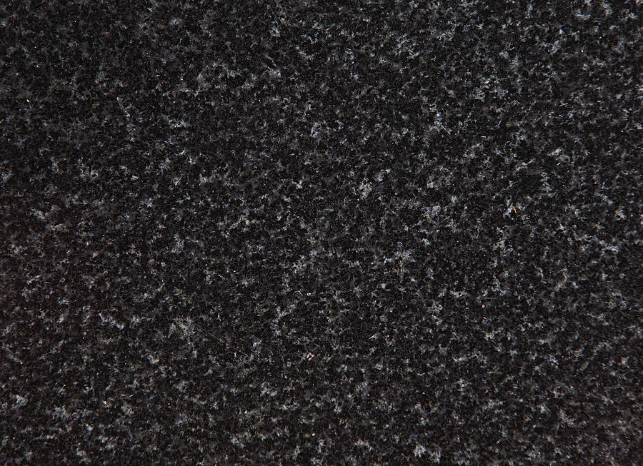 An up close view of black and grey speckled granite  Photograph by CostinT