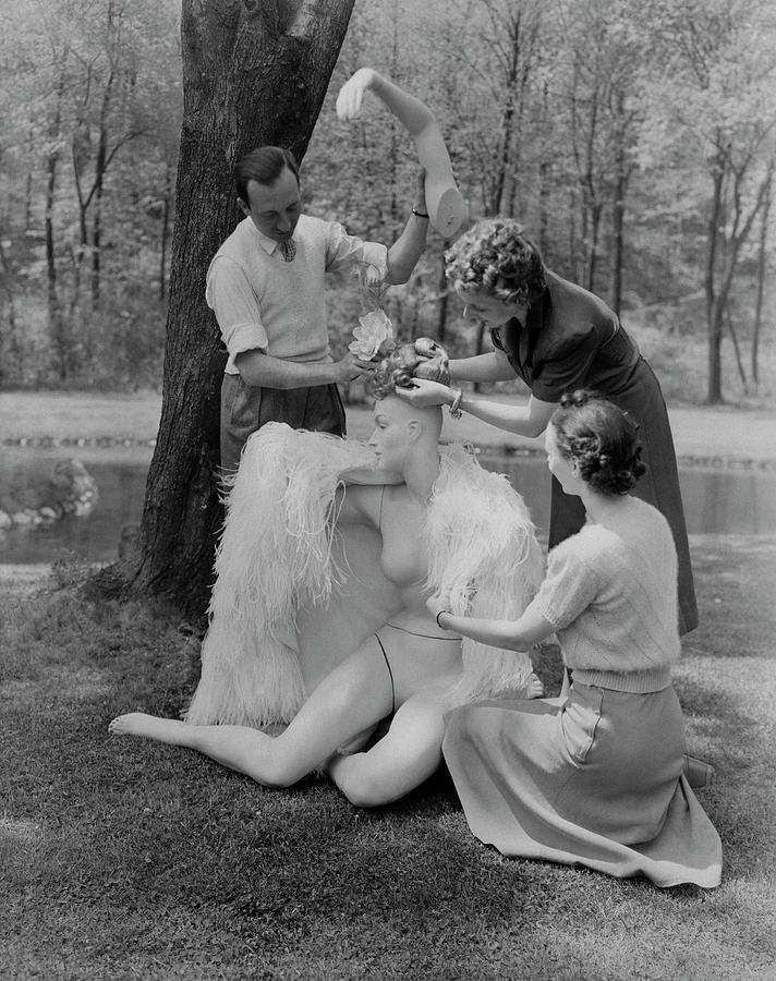 Andre Durst And Two Women Assembling A Mannequin Photograph by Andre Durst
