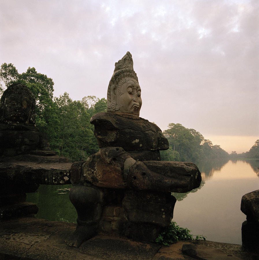 Angkor Deity Photograph by Shaun Higson