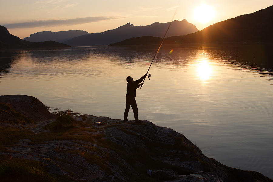 Angler at sunset Photograph by Ulrich Kunst And Bettina Scheidulin