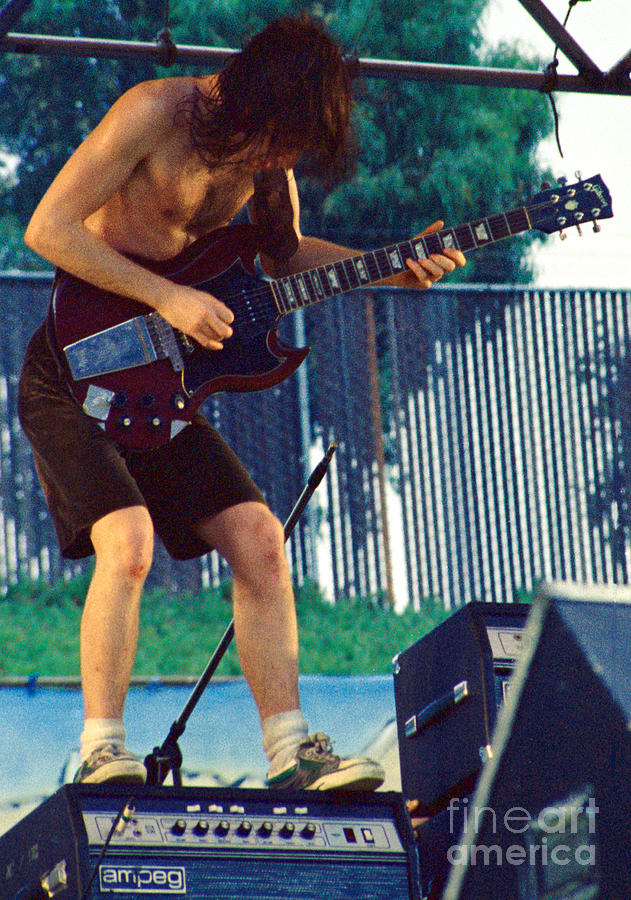 Angus Young of A C D C at Day on the Green Monsters of Rock Photograph by Daniel Larsen