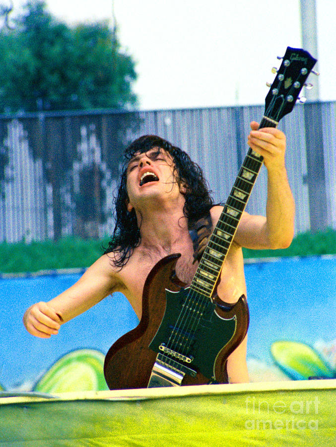 Angus Young of A C D C at Day on the Green Monsters of Rock  7-21-79  Photograph by Daniel Larsen