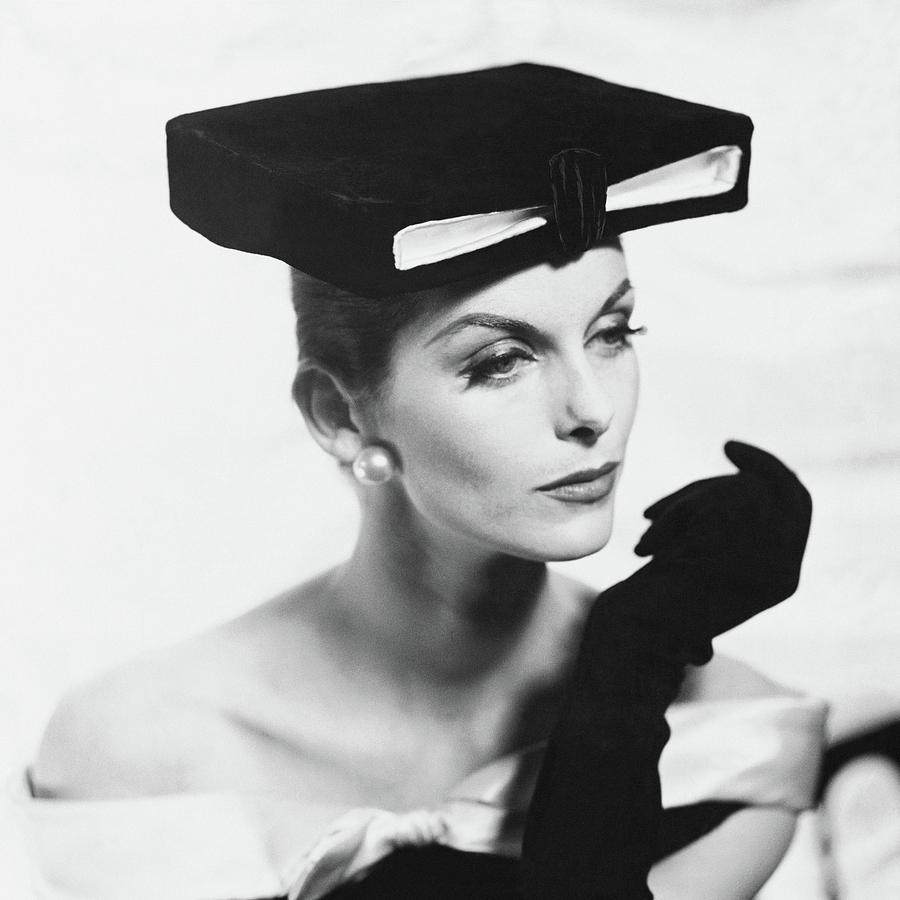 Anne St. Marie Wearing A Givenchy Hat Photograph by Henry Clarke