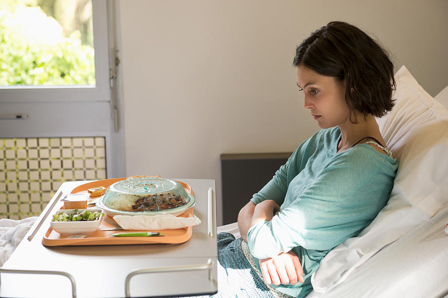 Anorexia nervosa patient with a food tray in hospital ward Photograph by Eric Audras