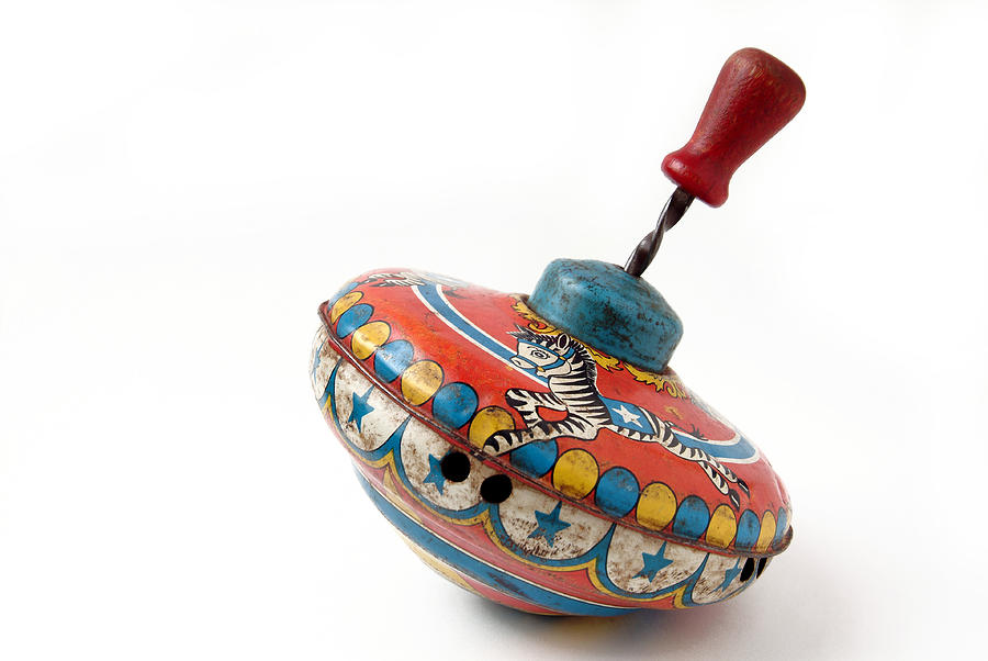 Antique Brightly Painted Metal Childs Toy Spinning Top Photograph by Stephanie Phillips