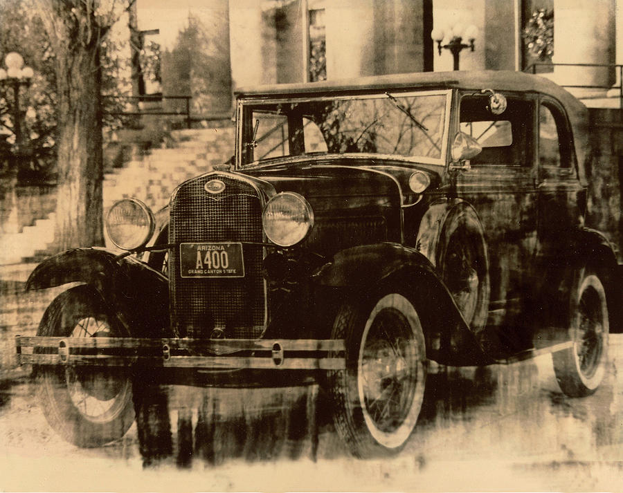 Antique car Photograph by James Bethanis