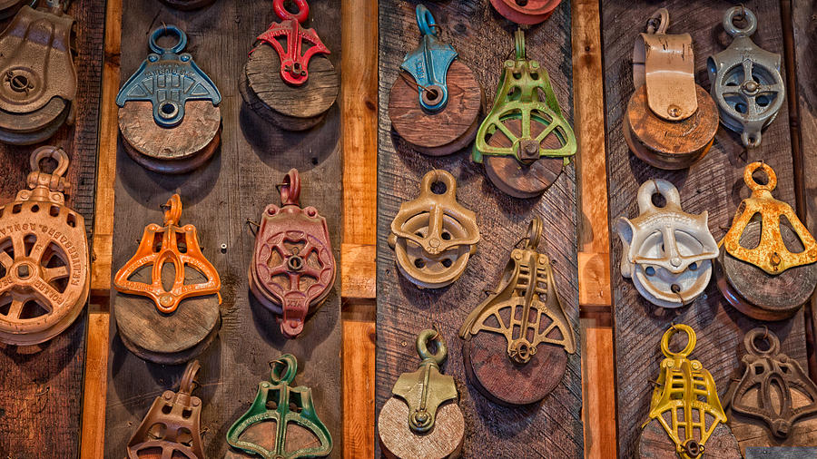 Antique Pulleys Photograph by Bill Wakeley