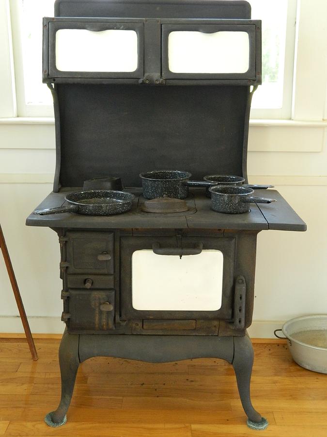 Antique Stove Number 2 Photograph by George Pedro