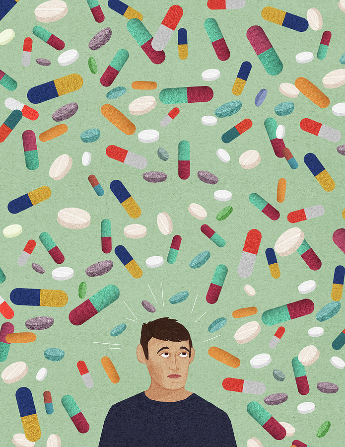 Anxious Man Surrounded By Lots Of Pills Photograph by Ikon Ikon Images