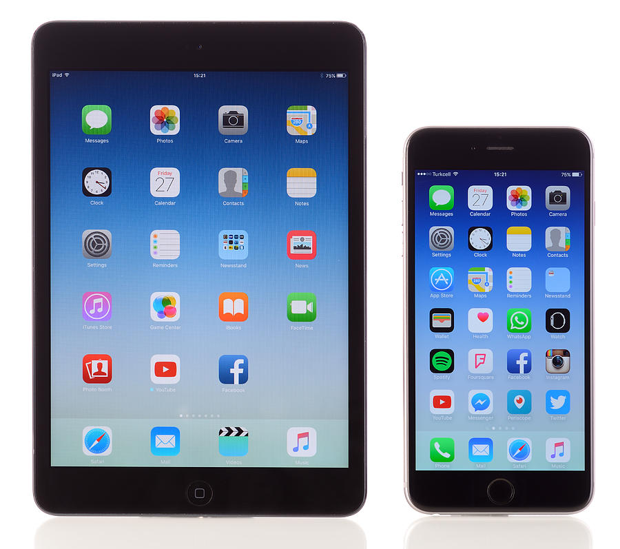 Apple iPad Mini and iPhone 6 Plus on white background Photograph by Hocus-focus