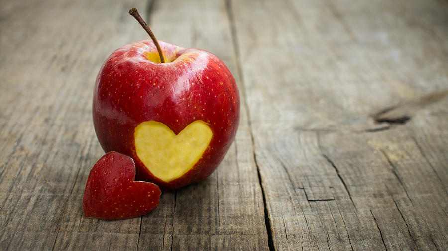 Apple Photograph - Apple with engraved heart by Aged Pixel