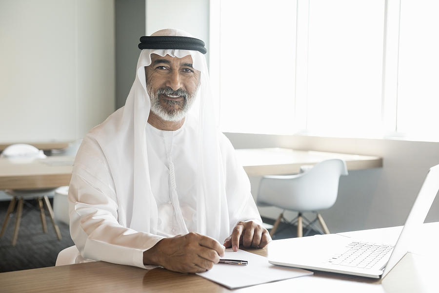 Arab businessman confident and smiling in office Photograph by JohnnyGreig
