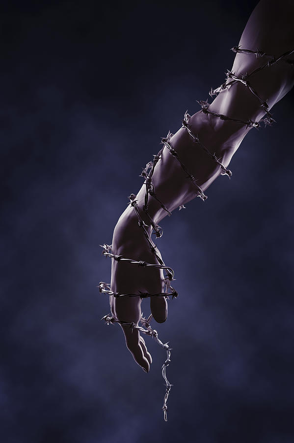 Arm and hand wrapped in barbed wire Photograph by Chris Clor