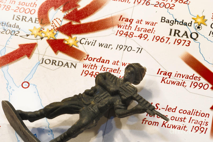 Map Photograph - Army Man lying on Middle East Conflicts Map by Amy Cicconi