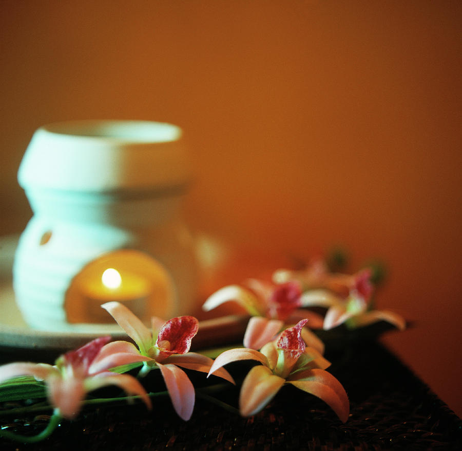 Flower Photograph - Aromatherapy Burner And Flowers by Cristina Pedrazzini/science Photo Library