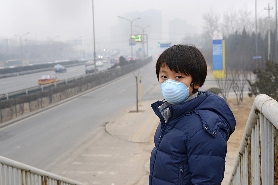 Asian boy wearing mouth mask against air pollution (Beijing) Photograph by Hung_Chung_Chih